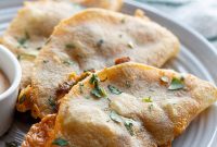 Crispy Chicken Tacos with Tangy Slaw and Avocado crema