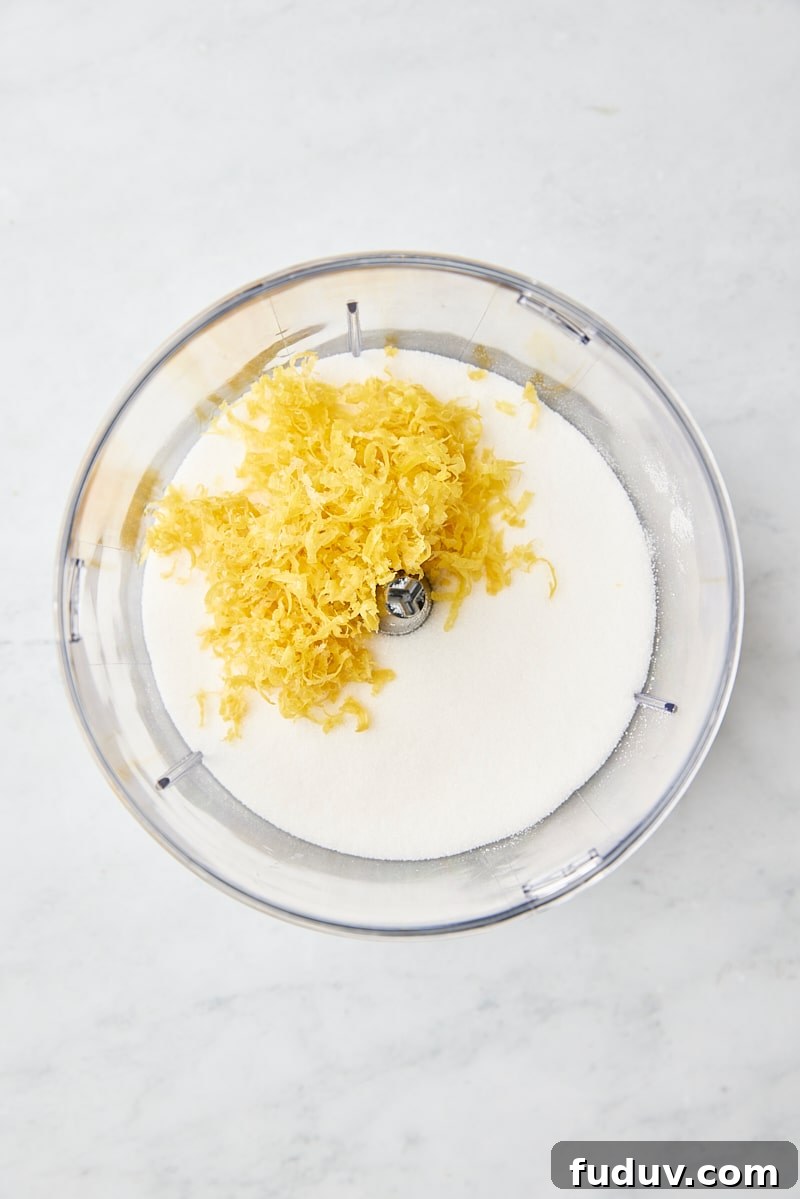 Lemon zest and granulated sugar in food processor