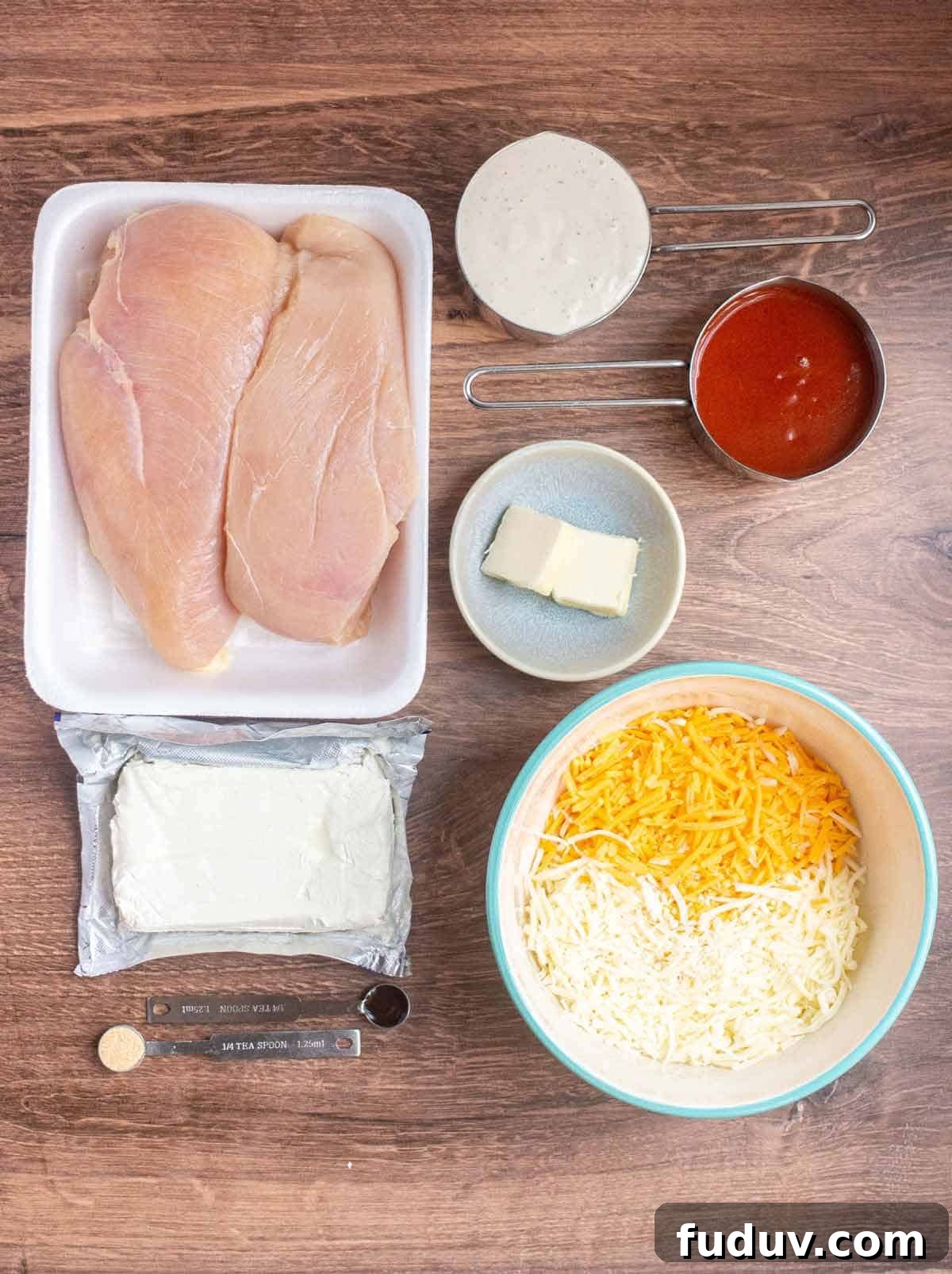 Ingredients for Instant Pot Buffalo Chicken Dip laid out on a counter.