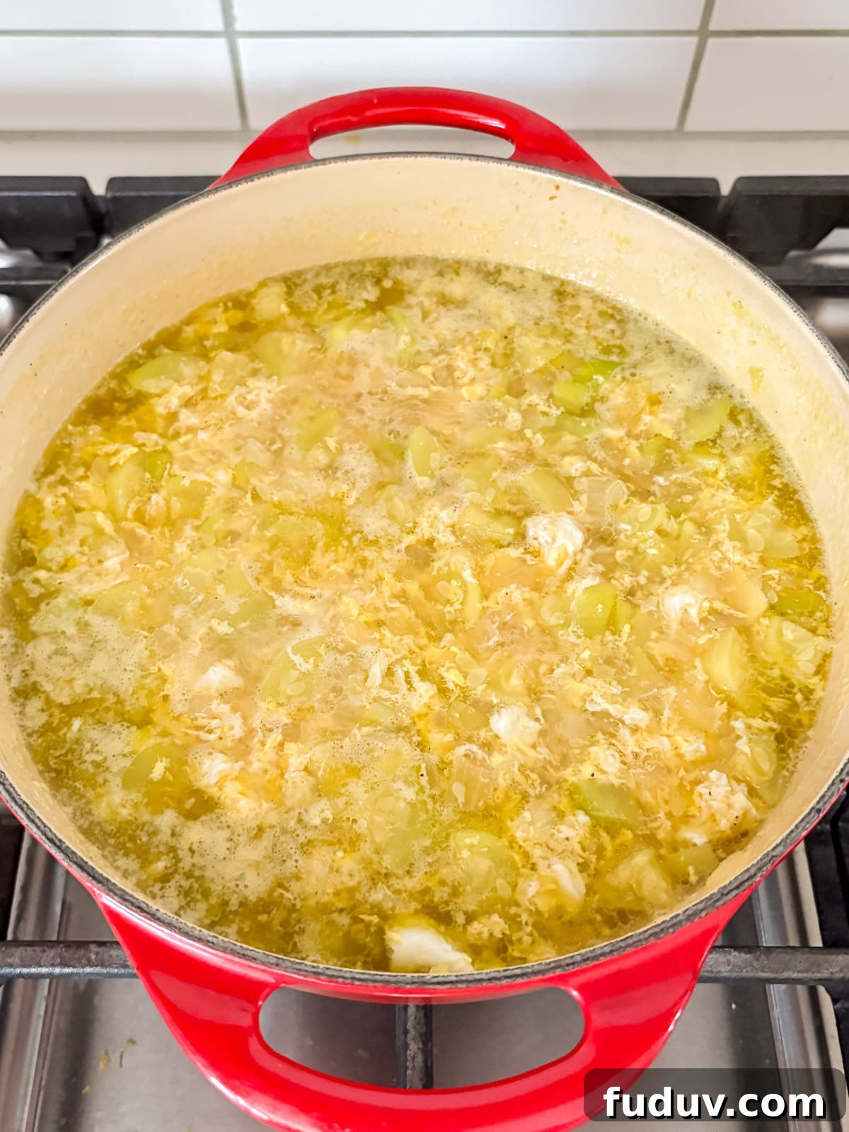 Broth added and simmered then eggs cracked in and cooked in bubbling soup.
