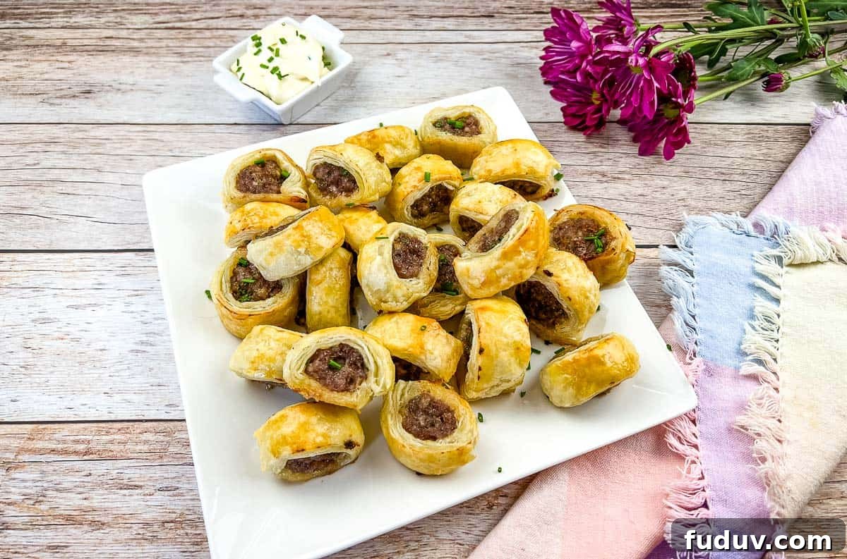 Sausage Rolls on a white plate.