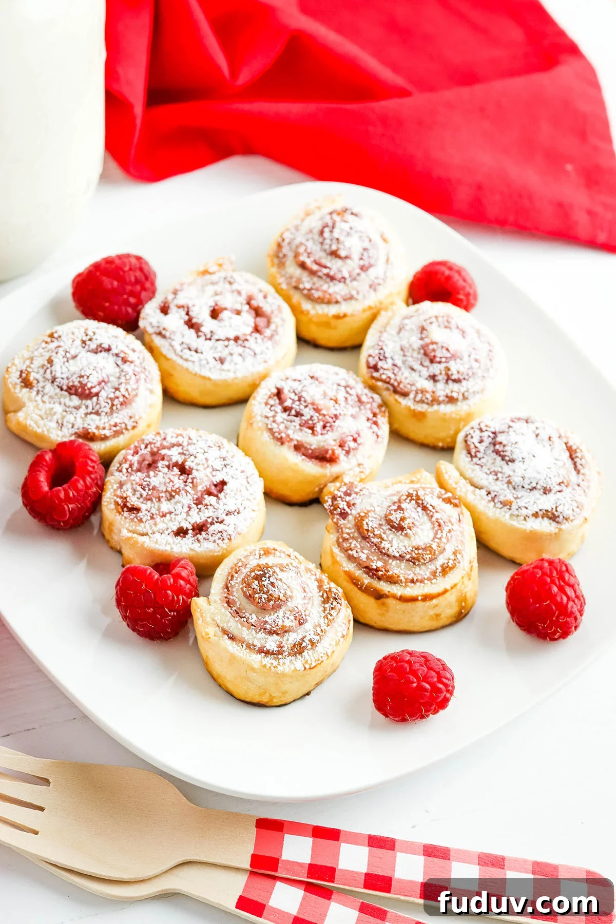 Raspberry Pinwheels on white square serving platter.
