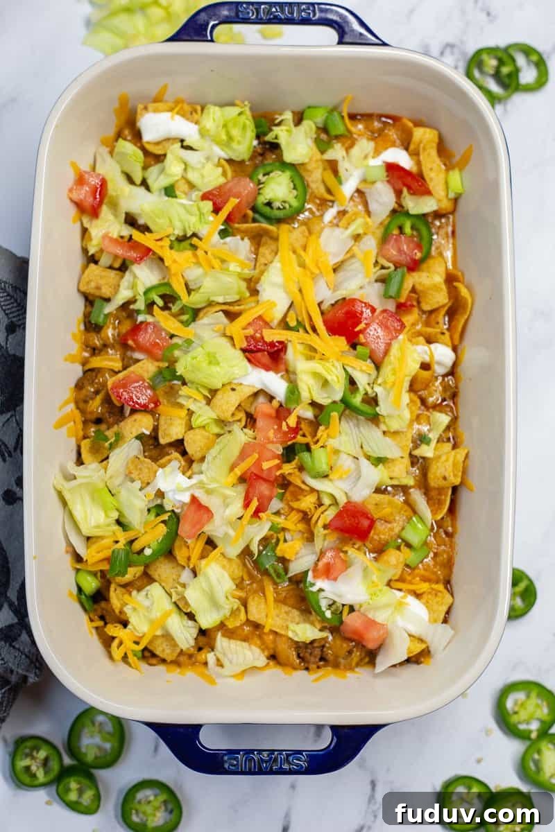 Walking taco casserole in baking dish.
