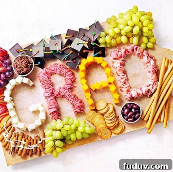 Grad written out in meat and cheese with candy graduation hats from Savory Online.