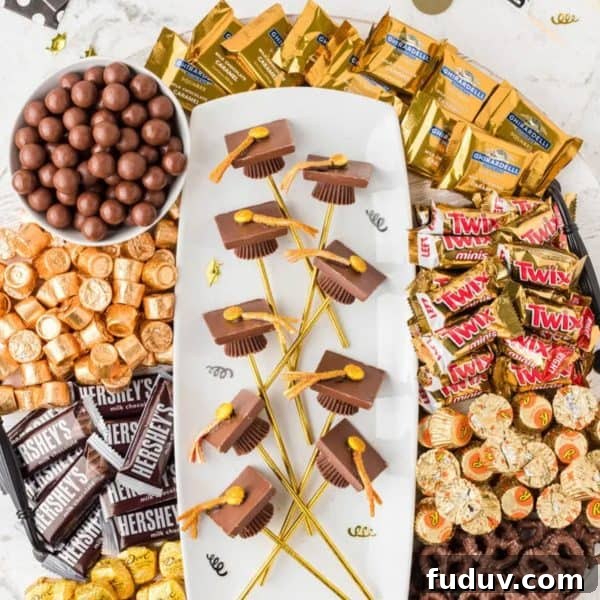 A candy board with candy graduation hats from The Denver Housewife.