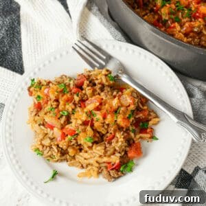 A plate of the casserole with a fork on the side.