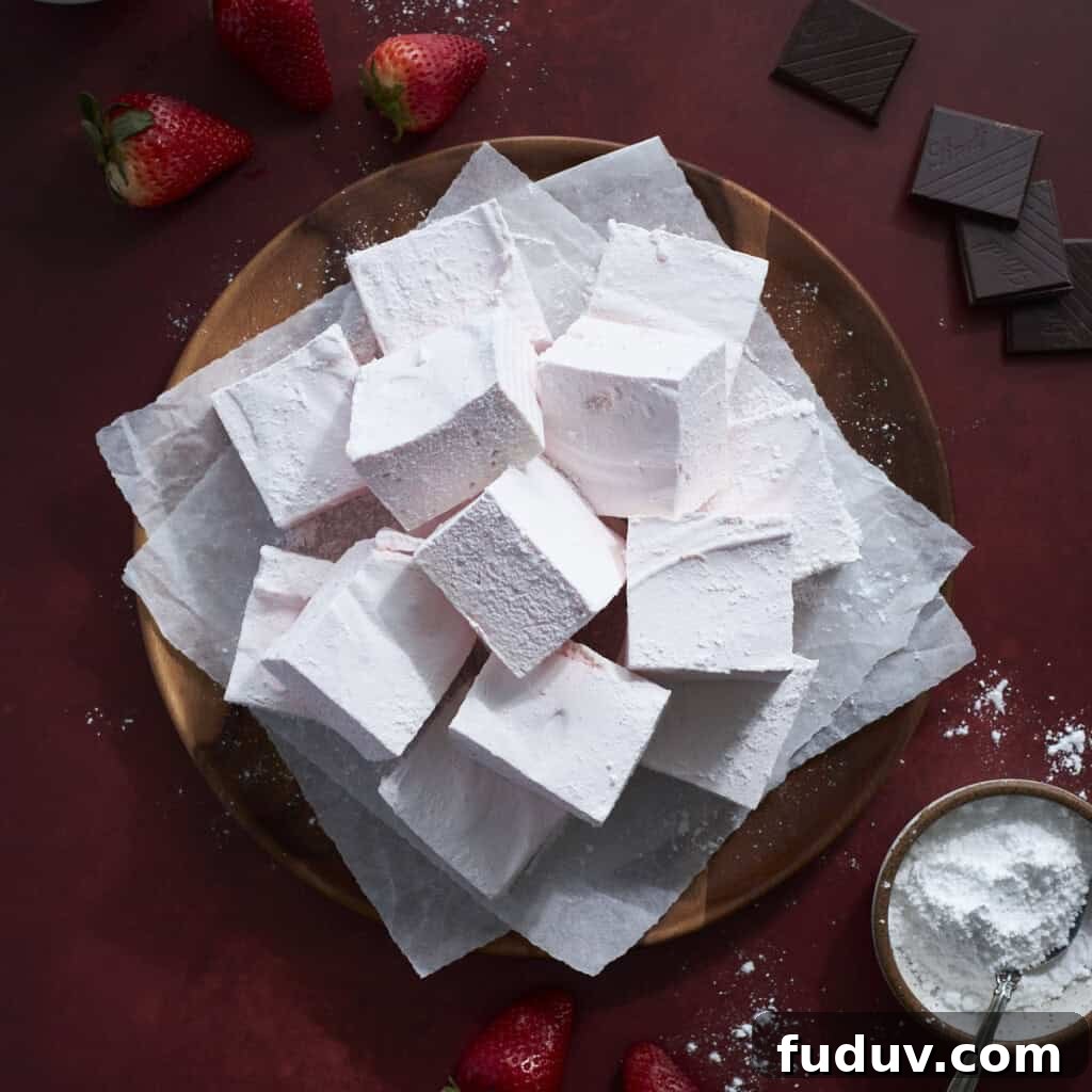 Strawberry Pink Marshmallows on a wooden tray.