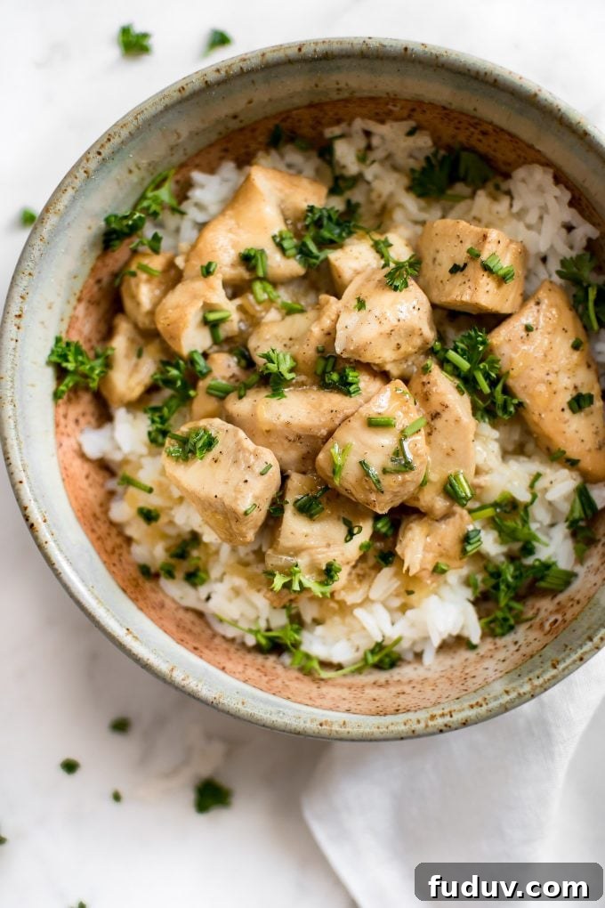 close-up of easy Instant Pot honey garlic chicken served over rice in a bowl