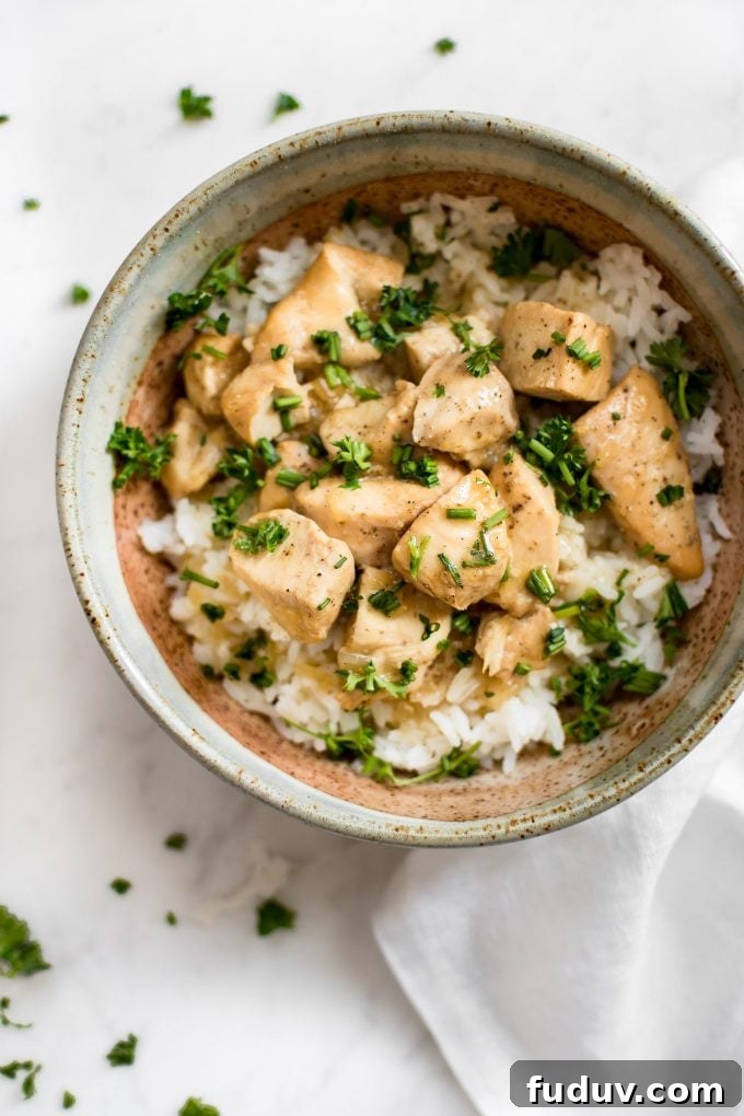 Instant Pot honey garlic chicken in a bowl over rice
