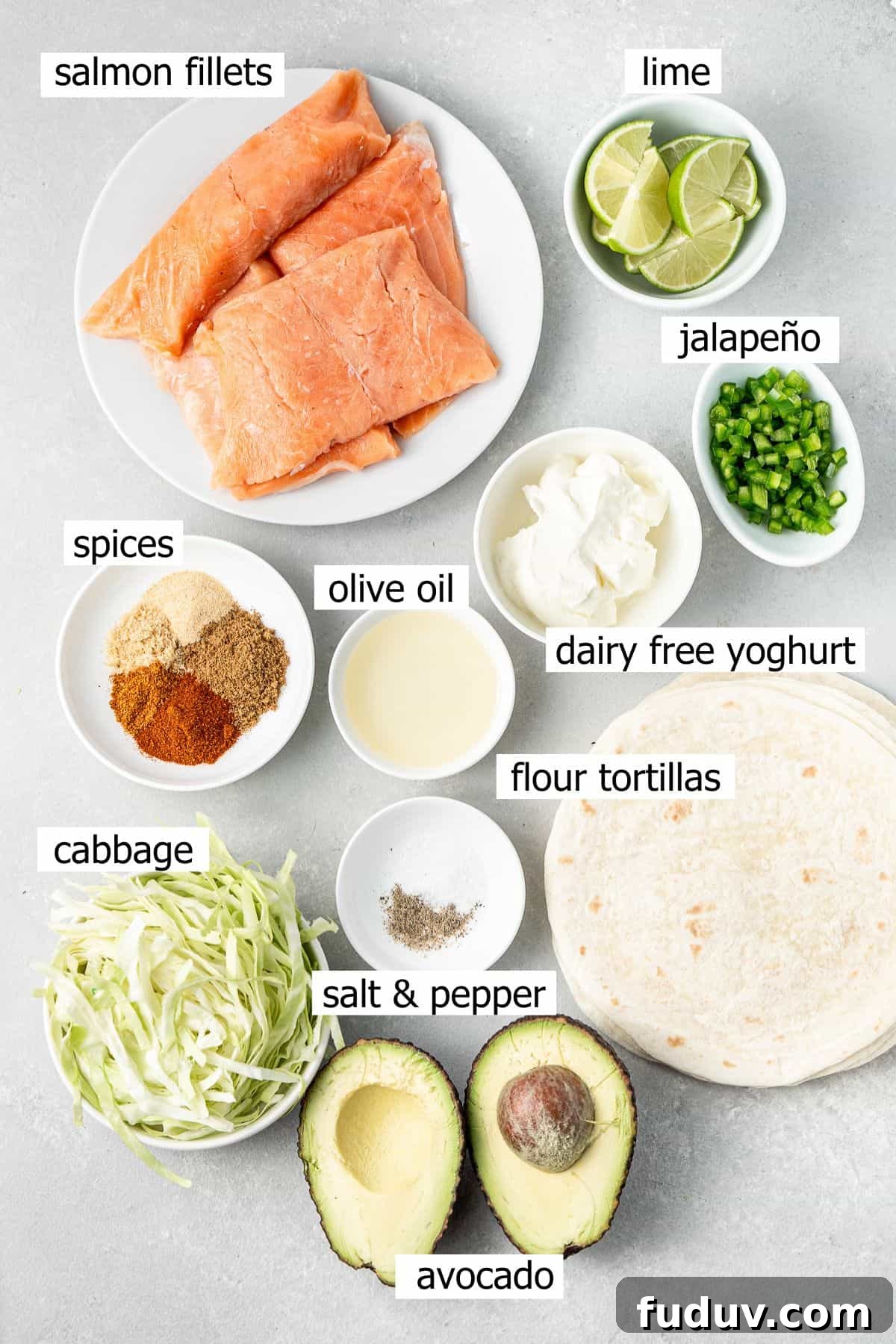 Grilled Salmon Tacos with Creamy Avocado Lime Crema 3 All ingredients needed to make grilled salmon tacos with avocado crema laid out in small bowls.