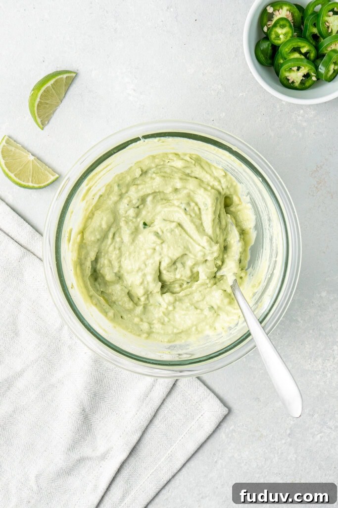 Grilled Salmon Tacos with Creamy Avocado Lime Crema 7 The avocado crema mixed up in a glass bowl.