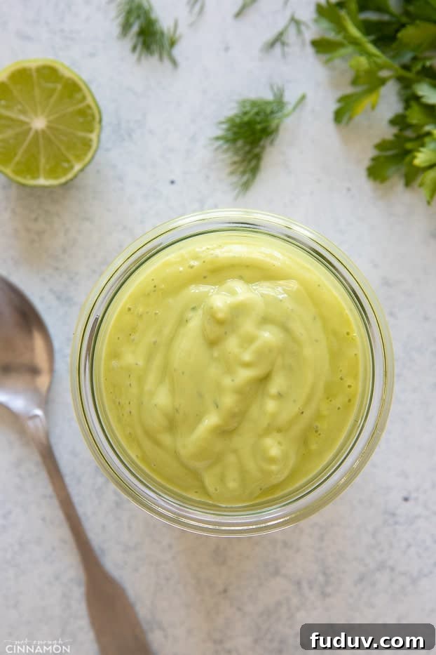 avocado ranch overhead shot of a mason jar with avocado ranch dressing