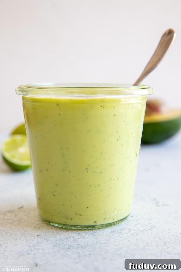 avocado ranch side view of vegan avocado ranch dressing in a small mason jar