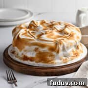 Cipriani vanilla meringue cake on a cake stand.