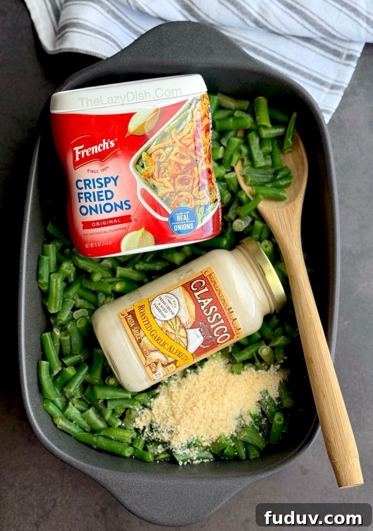 Quick and easy green bean casserole vegetable side dish made with Alfredo sauce and crispy fried onions.