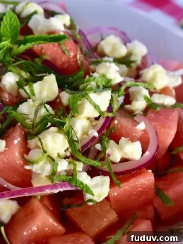Watermelon feta salad in a white bowl.