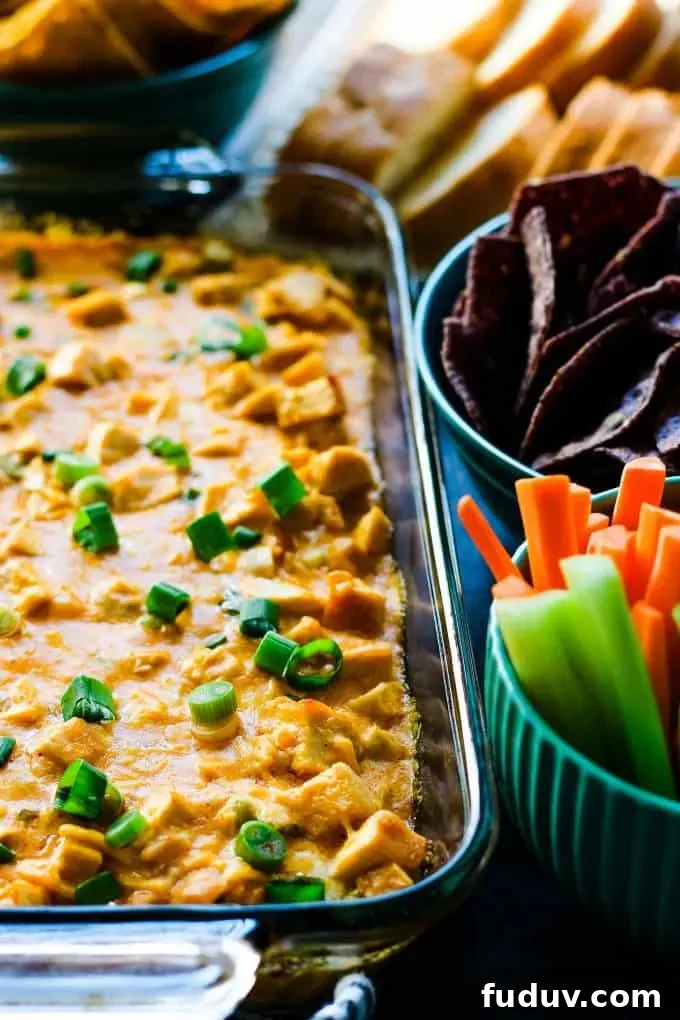 buffalo chicken dip with carrots, chips, and bread