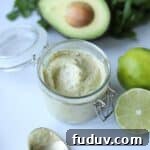 Lime aioli sauce in glass jar.