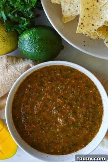 Mango Salsa is dish with tortilla chips and lime and mango.