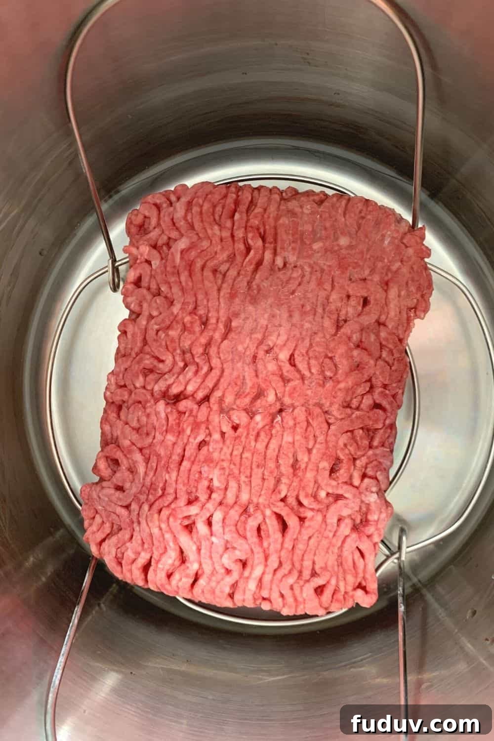 frozen ground beef on the trivet in the Instant Pot pressure cooker