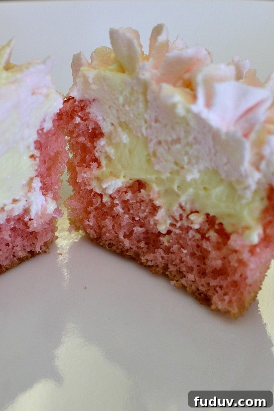 Center cut of a strawberry cupcake with lemon pudding center.