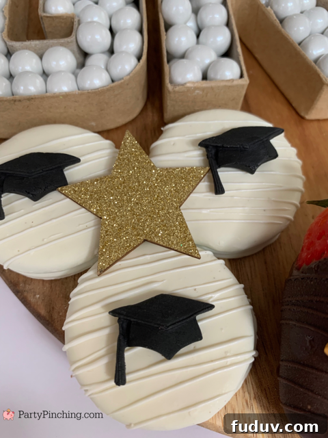 Graduation Dessert Board Ideas for Party-Worthy Celebration Treats 17 graduation dessert board, graduation charcuterie board, best graduation snack board ideas, best grad party ideas, best graduation open house party ideas, easy graduation food dessert snack appetizer recipes, best graduation decor ideas, graduation cap ferrero rocher, grad paper mache cardboard letter number candy dish, graduation cap oreos, graduation book yearbook hersheys nugget candy, graduation diploma cookies, graduation diploma brownies cupcakes, graduation dipped strawberries, fondant graduation decorations