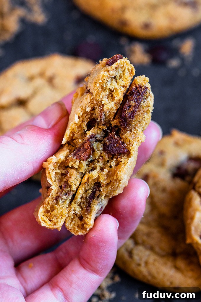 These soft and chewy Vegan Chocolate Chip Cookies are ready in under 30 mins and peppered with oozing vegan chocolate chips. Easy to make and utterly divine, these are bound to become family favourites!