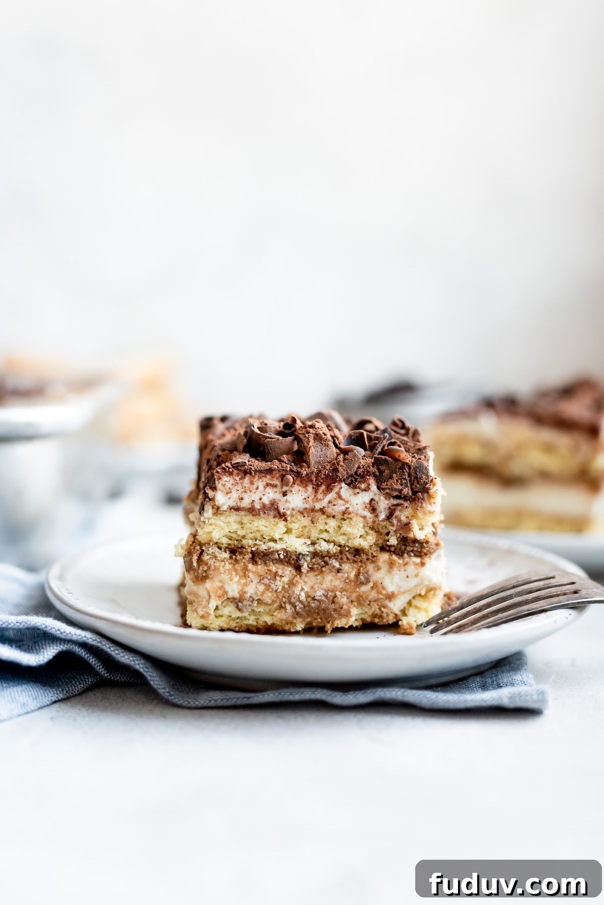 slice of tiramisu on plate showing layers