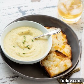 Plate with cheese toasts and a bowl of Parsnip and Golden Beet Soup.