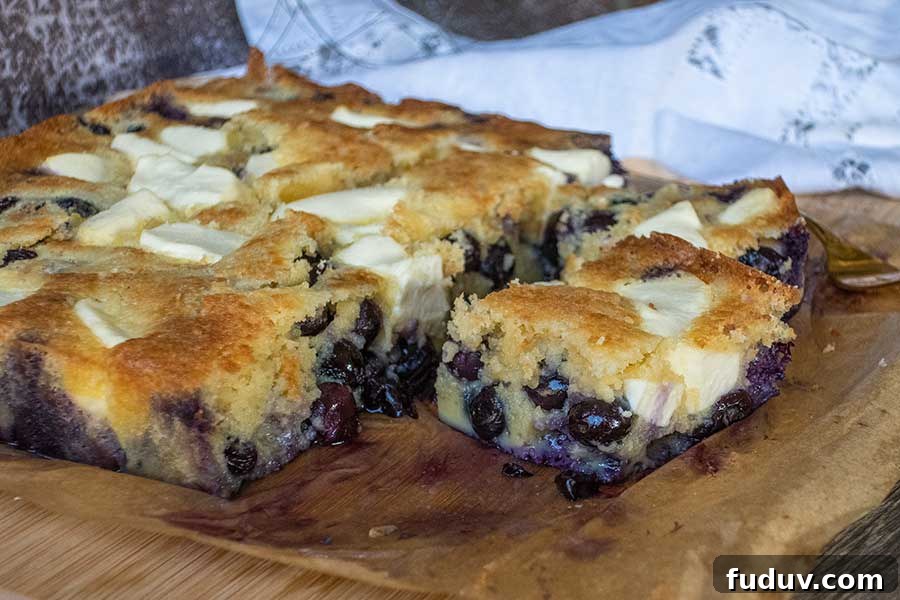 slice of keto and low-carb cream cheese blueberry butter cake