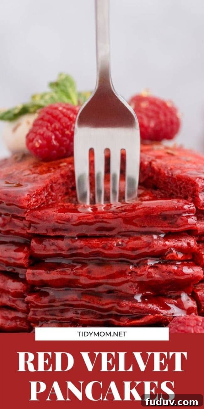 Red Velvet Pancakes Recipe with Video Tutorial 11 a stack of red pancakes with a form stabbing in them
