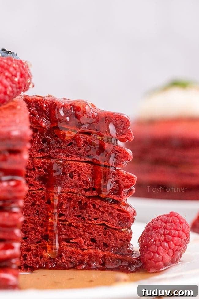 Red Velvet Pancakes Recipe with Video Tutorial 3 a cut stack of pancakes