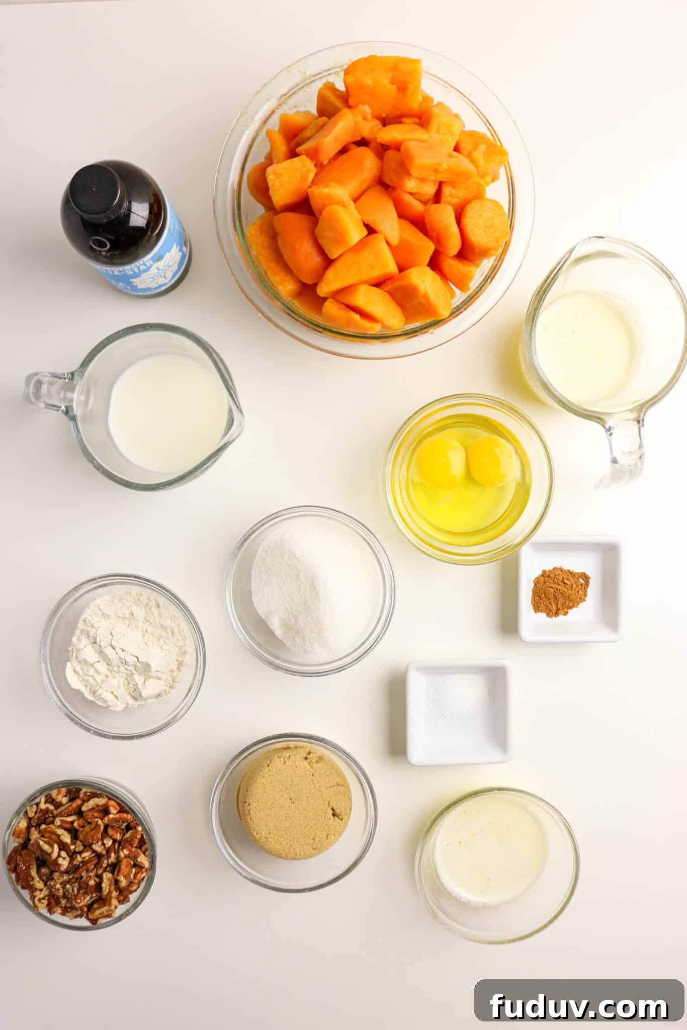 Sweet Potato Casserole Made with Canned Yams — Quick Holiday Side 3 Ingredients for Sweet Potato Casserole made from canned yams: pecans, brown sugar, milk, canned yams, cinnamon, eggs, vanilla, sugar, and salt - Hostess At Heart