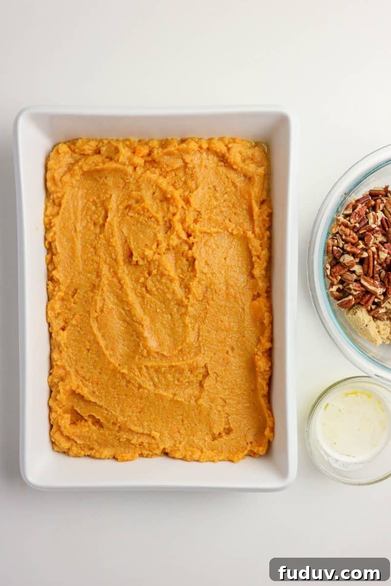 Sweet Potato Casserole Made with Canned Yams — Quick Holiday Side 7 Sweet potato mixture spread evenly in a greased 9x13 inch baking dish - Hostess At Heart