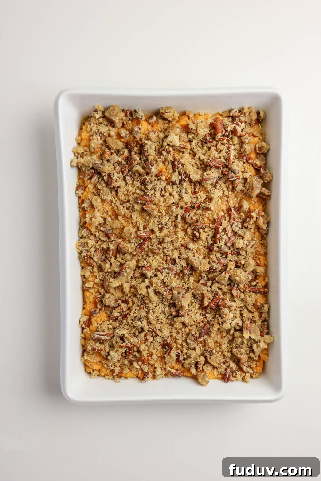 Sweet Potato Casserole Made with Canned Yams — Quick Holiday Side 9 Unbaked sweet potato casserole with pecan topping ready to go in the oven - Hostess At Heart
