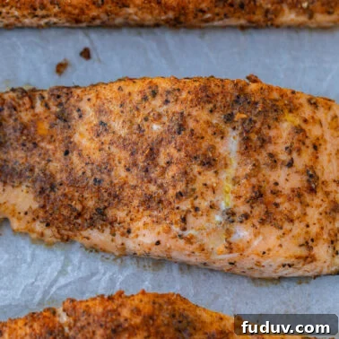 Square image of baked salmon.