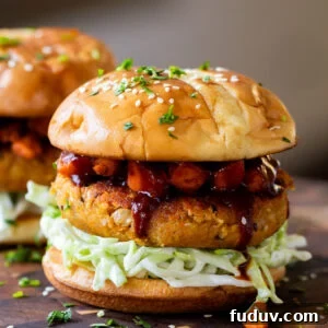 Peanut white bean burger topped with roasted sweet potato, cabbage and burger buns