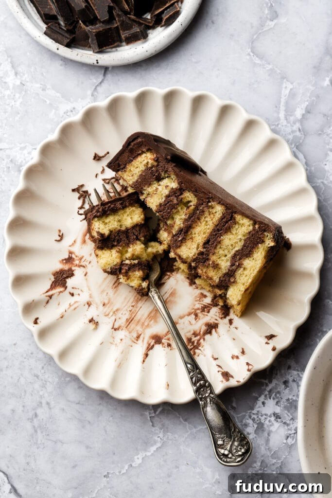 slice of prinzregententorte on a plate with a few bites taken out