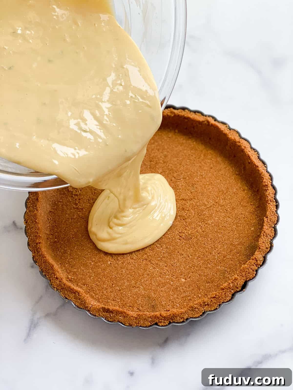 filling being poured into the crust.
