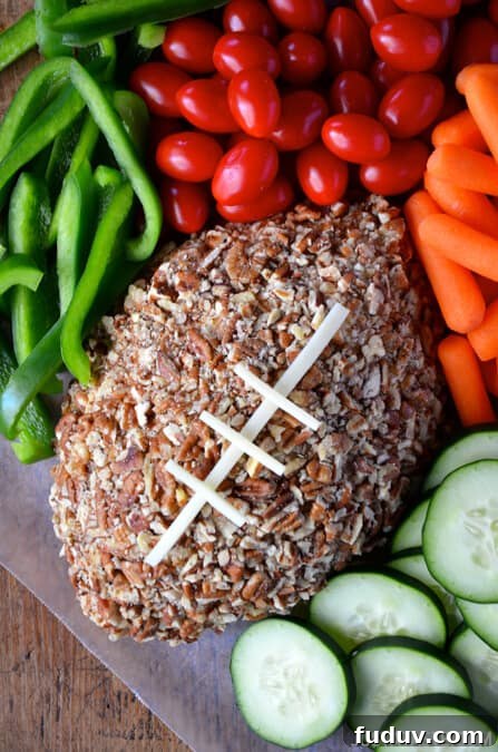 Easy Football Cheese Ball from justataste.com #recipe #video