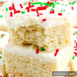 A Christmas cookie bar with a bite taken out of it.
