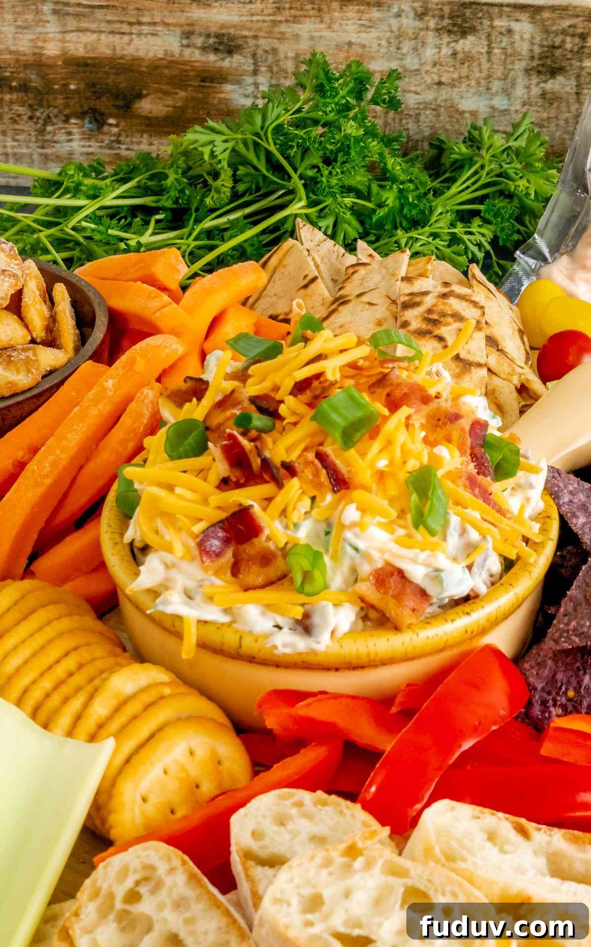 Million-Dollar Dip Recipe: Luxurious Party Appetizer with Truffle and Lobster 2 A vintage bowl overfilled with million dollar dip with crispy bacon and fresh scallions.