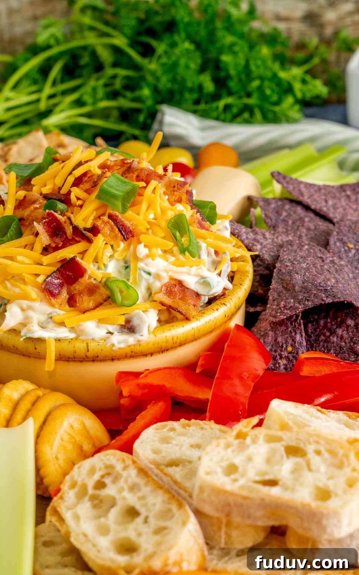 Million-Dollar Dip Recipe: Luxurious Party Appetizer with Truffle and Lobster 5 A close up of million dollar dip with bread and veggies around it.