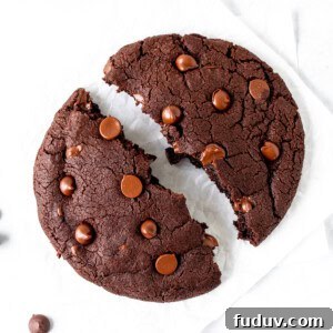 Single serving chocolate cookie, broken in half