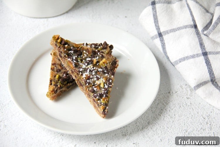 Cannoli Magic Bars recipe - gourmet cookie bars with an Italian twist cookies on plate