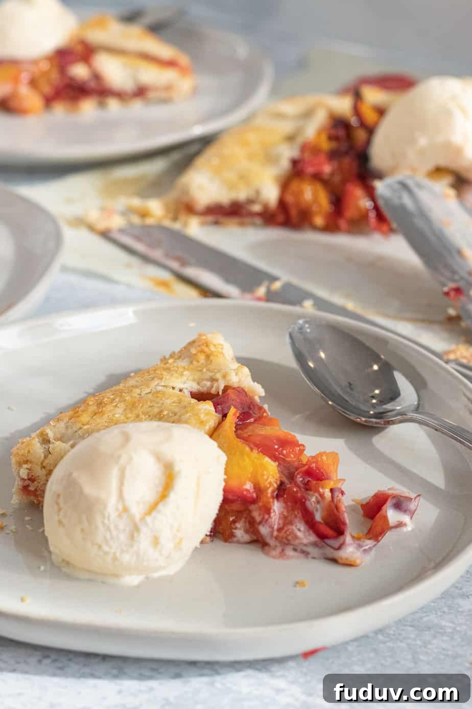 Peach Galette Recipe: Rustic Fresh Peach Tart for Summer 8 slice of peach galette on plate with vanilla ice cream