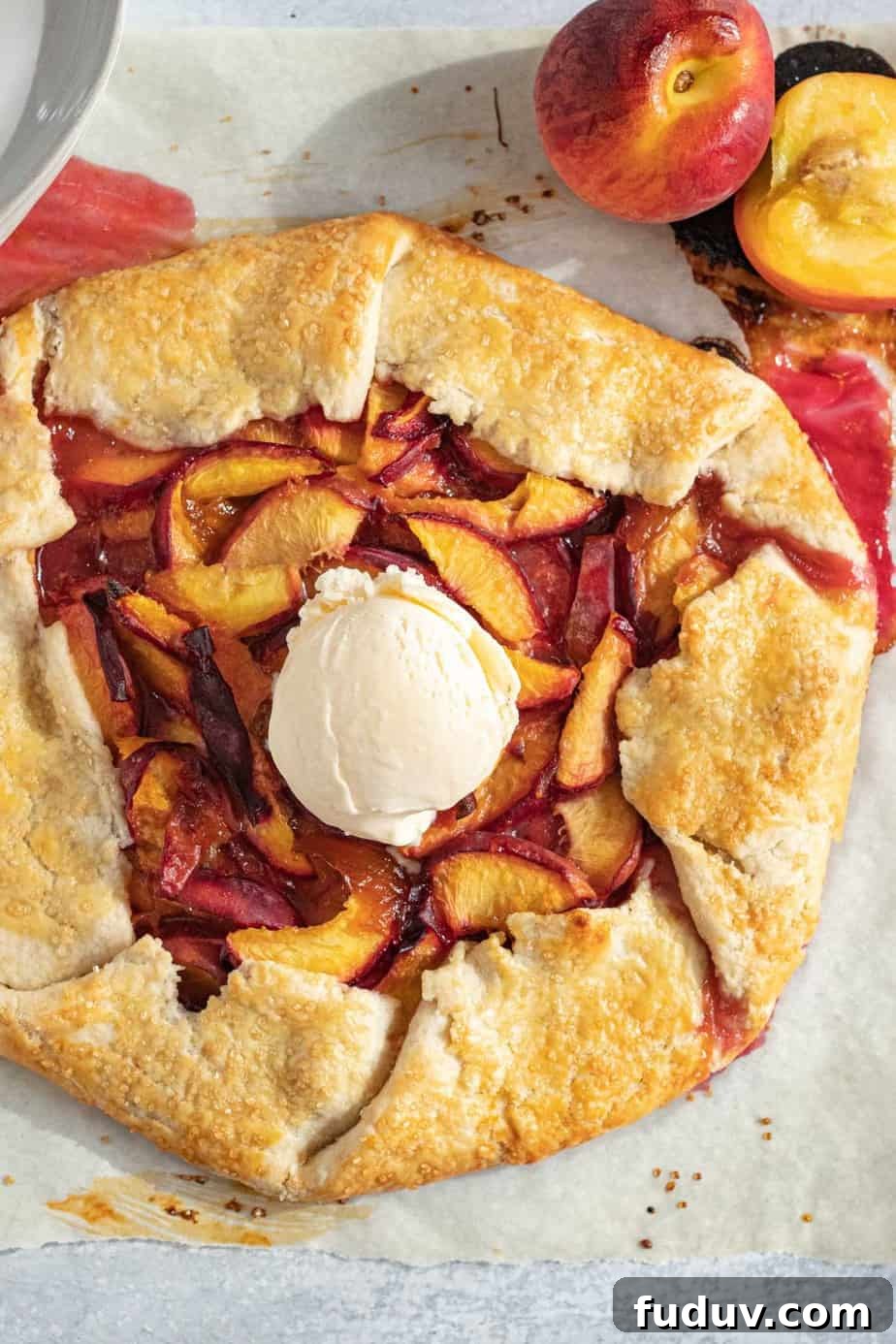 Peach Galette Recipe: Rustic Fresh Peach Tart for Summer 9 peach galette with vanilla ice cream scoop on top