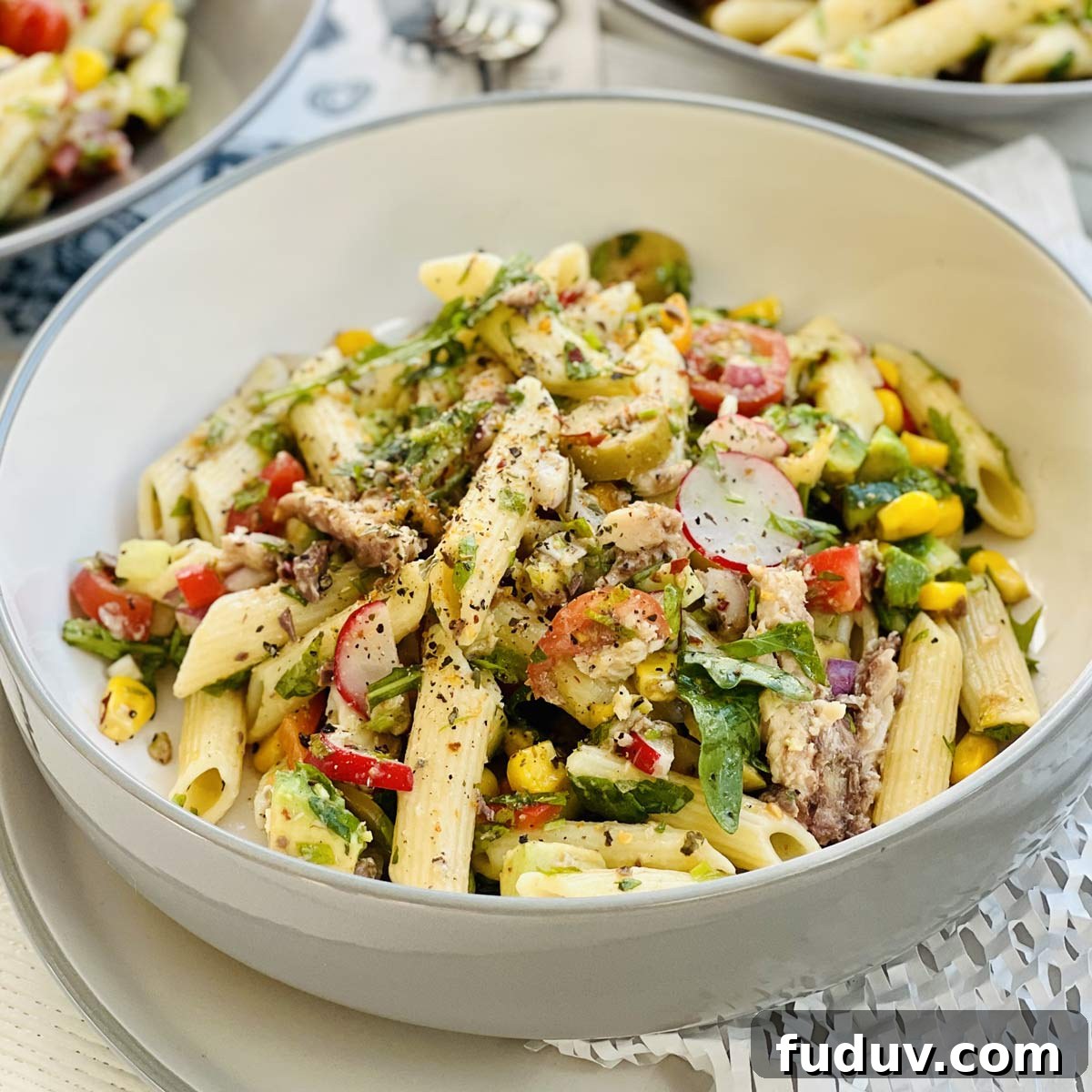 Spanish sardines pasta penne with sweet corn, radish black pepper and herbs