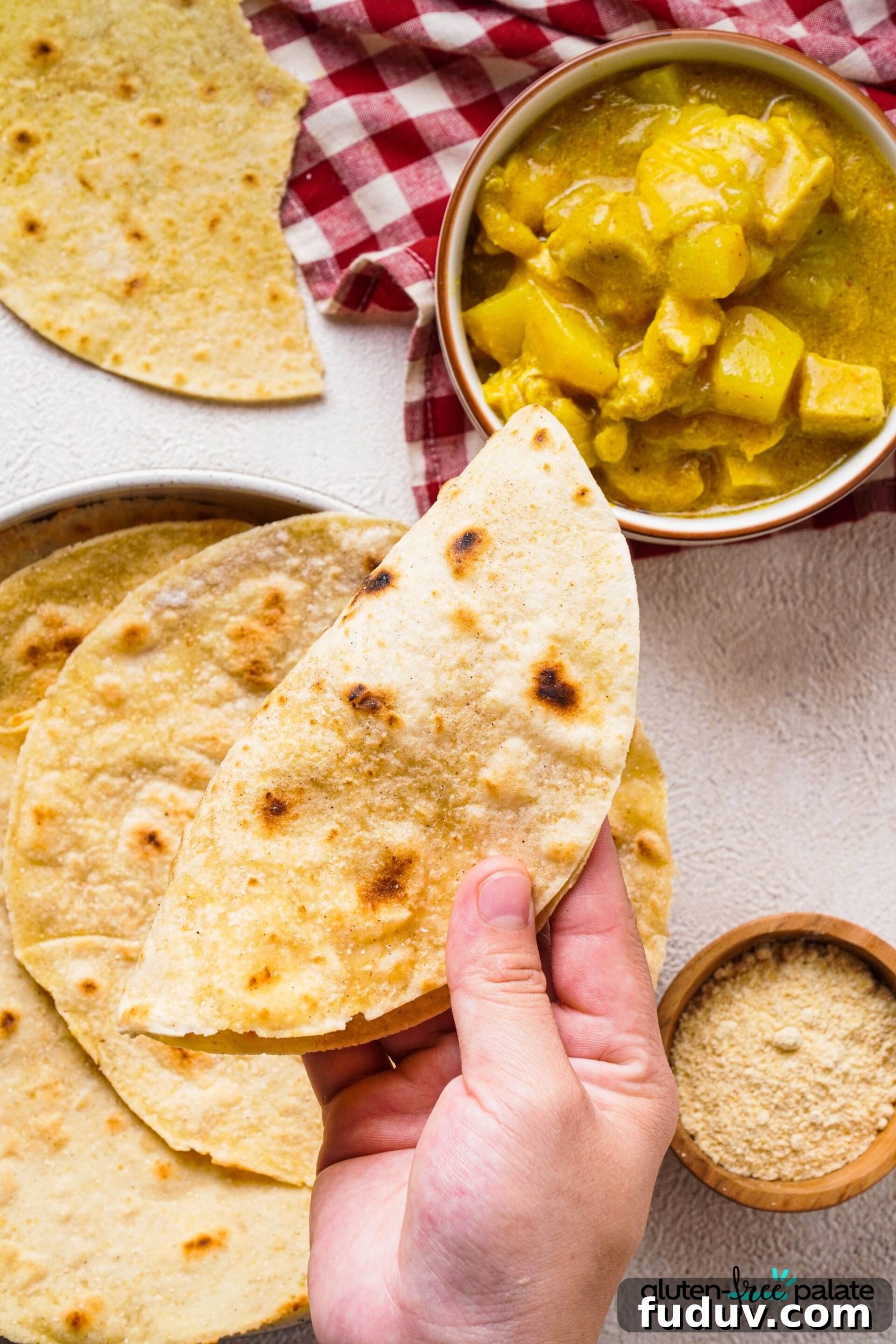 Gluten-free roti being served with curry