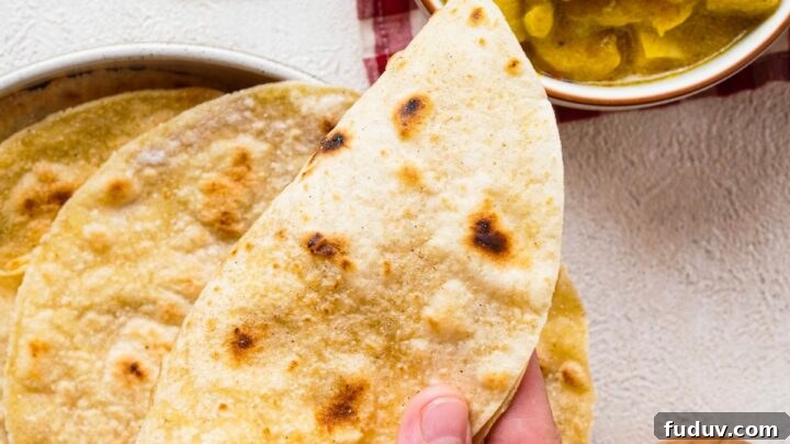 Gluten-free roti being served with curry
